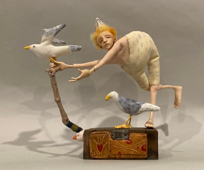 'Reaching Out' : figurative mixed media sculpture of a bather with seagulls. Clay, cloth and wire